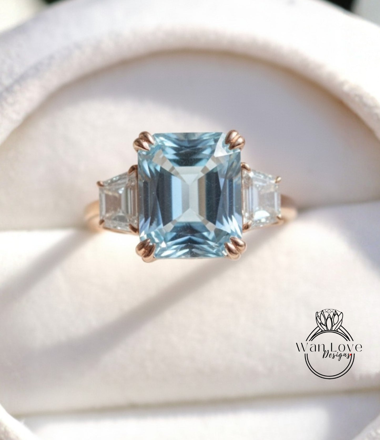 A close-up image of a gold ring with a large blue gemstone, showcasing the intricate details and craftsmanship of the jewelry.