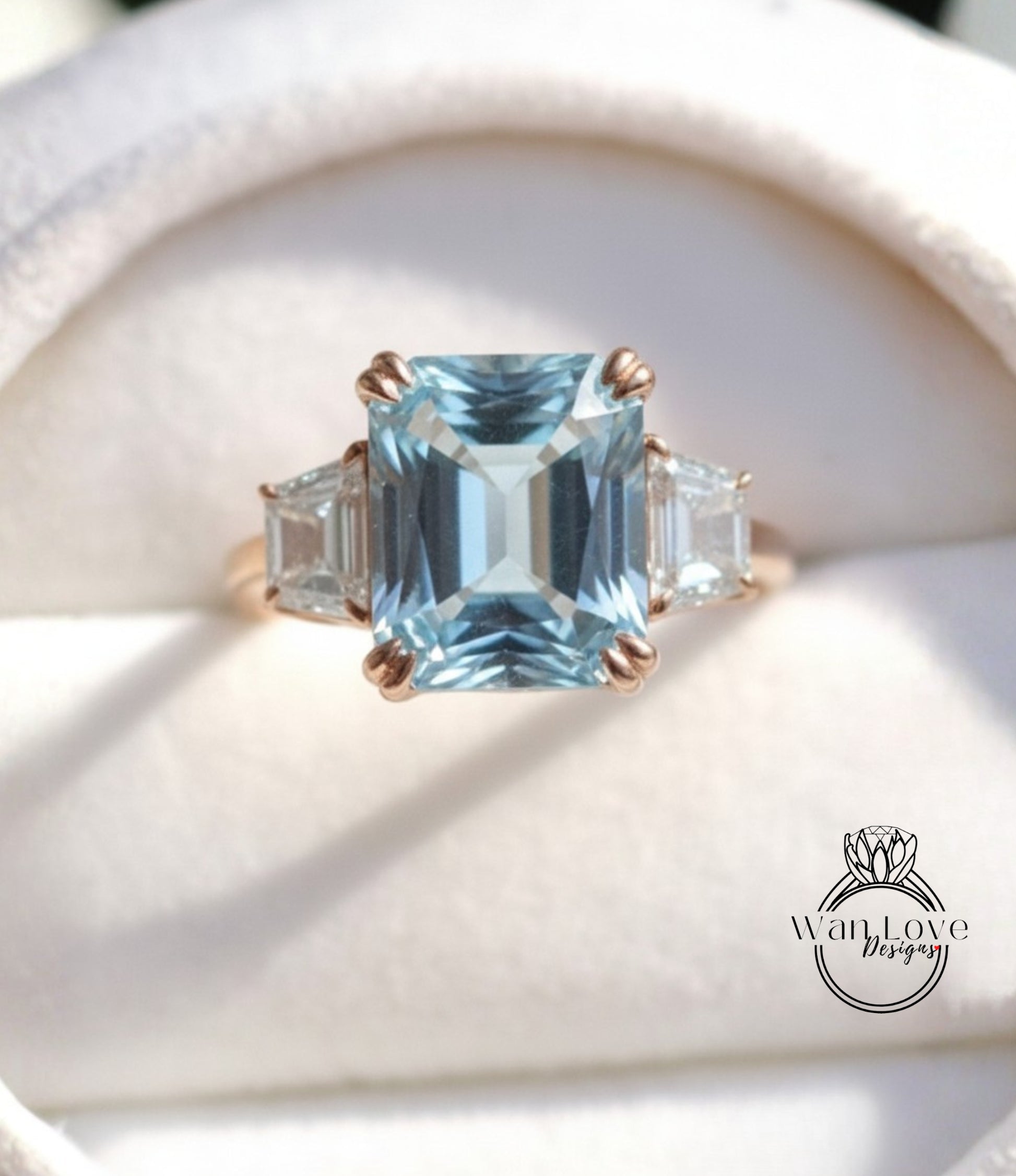 A close-up image of a gold ring with a large blue gemstone, showcasing the intricate details and craftsmanship of the jewelry.