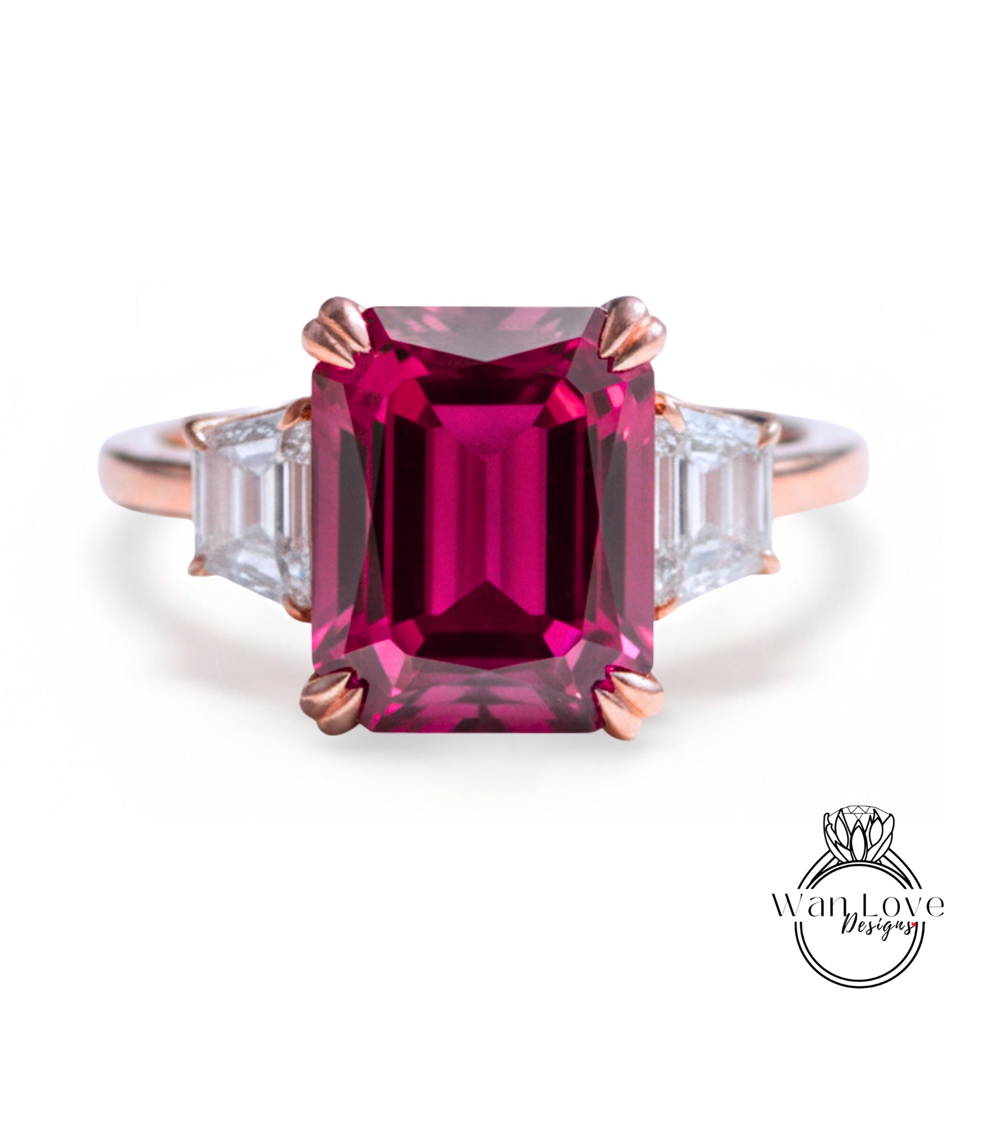A pink gemstone engagement ring with a large central gemstone surrounded by smaller diamonds on either side.