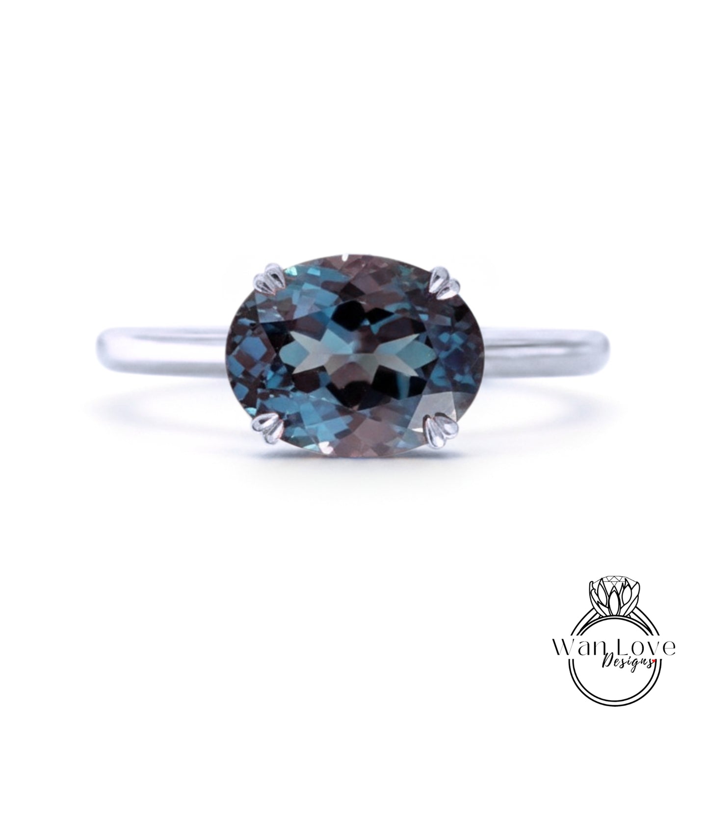 A silver ring with a large, round blue gemstone set in the center.