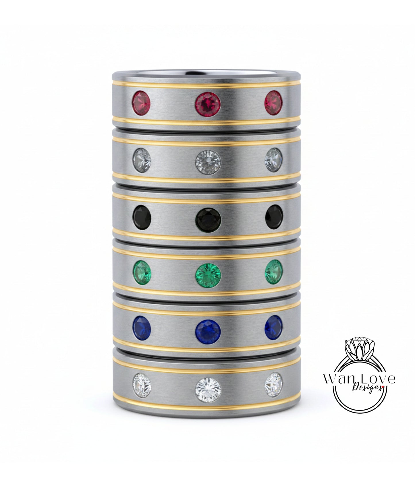 A stack of silver rings with colorful gemstones, including red, green, blue, and white stones, set in a metallic band with a yellow stripe.