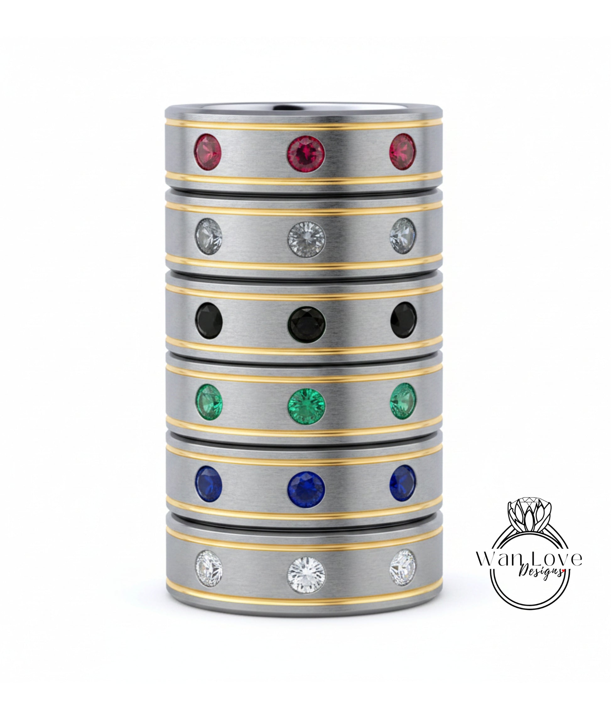 A stack of silver rings with colorful gemstones, including red, green, blue, and white stones, set in a metallic band with a yellow stripe.