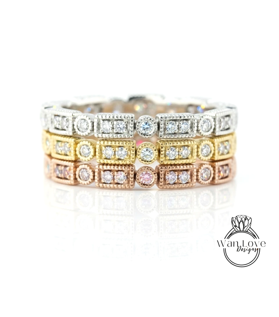 A close-up image of a ring with multiple layers of diamond-encrusted rings, showcasing the intricate design and craftsmanship.