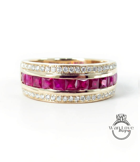 A gold ring with a row of pink gemstones, including rubies, set in a band.