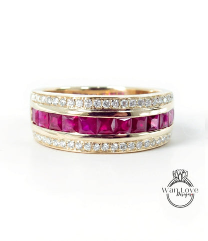 A gold ring with a row of pink gemstones, including rubies, set in a band.