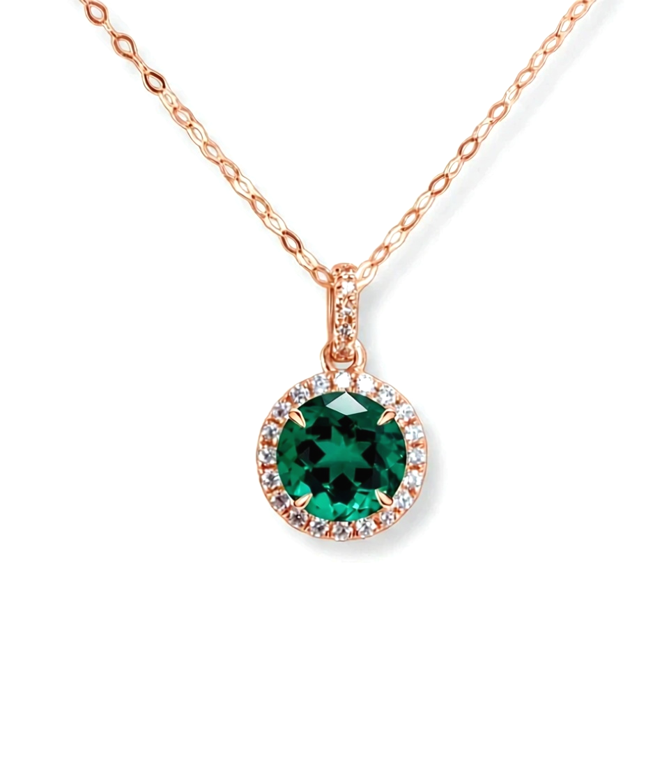 A necklace with a large, green gemstone pendant surrounded by smaller diamonds.