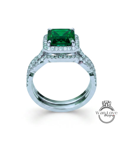 A silver ring with a large, square-cut green gemstone set in a halo of smaller diamonds.
