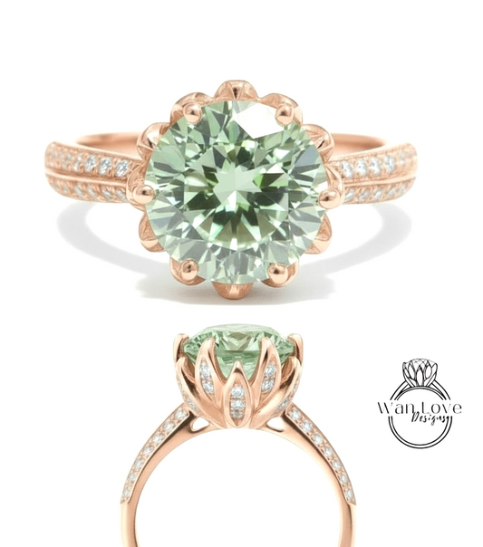 a beautiful rose gold ring with a large, round, mint green gemstone set in the center. The ring has a scalloped edge and is adorned with small diamonds around the band.