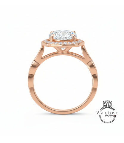 A rose gold engagement ring with a large round diamond set in the center, surrounded by smaller diamonds.