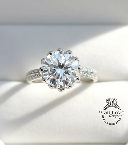 A close-up view of a diamond engagement ring with a large, round brilliant cut diamond set in a silver band.