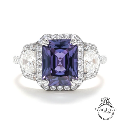 A stunning ring featuring a large, deep purple gemstone surrounded by smaller diamonds, set in a silver band.
