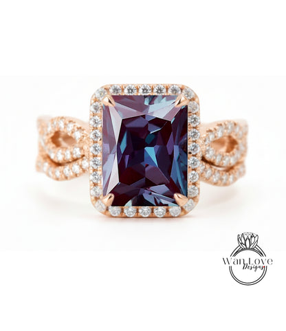 A large, rectangular purple gemstone set in a gold ring with a halo of smaller diamonds around the edges.