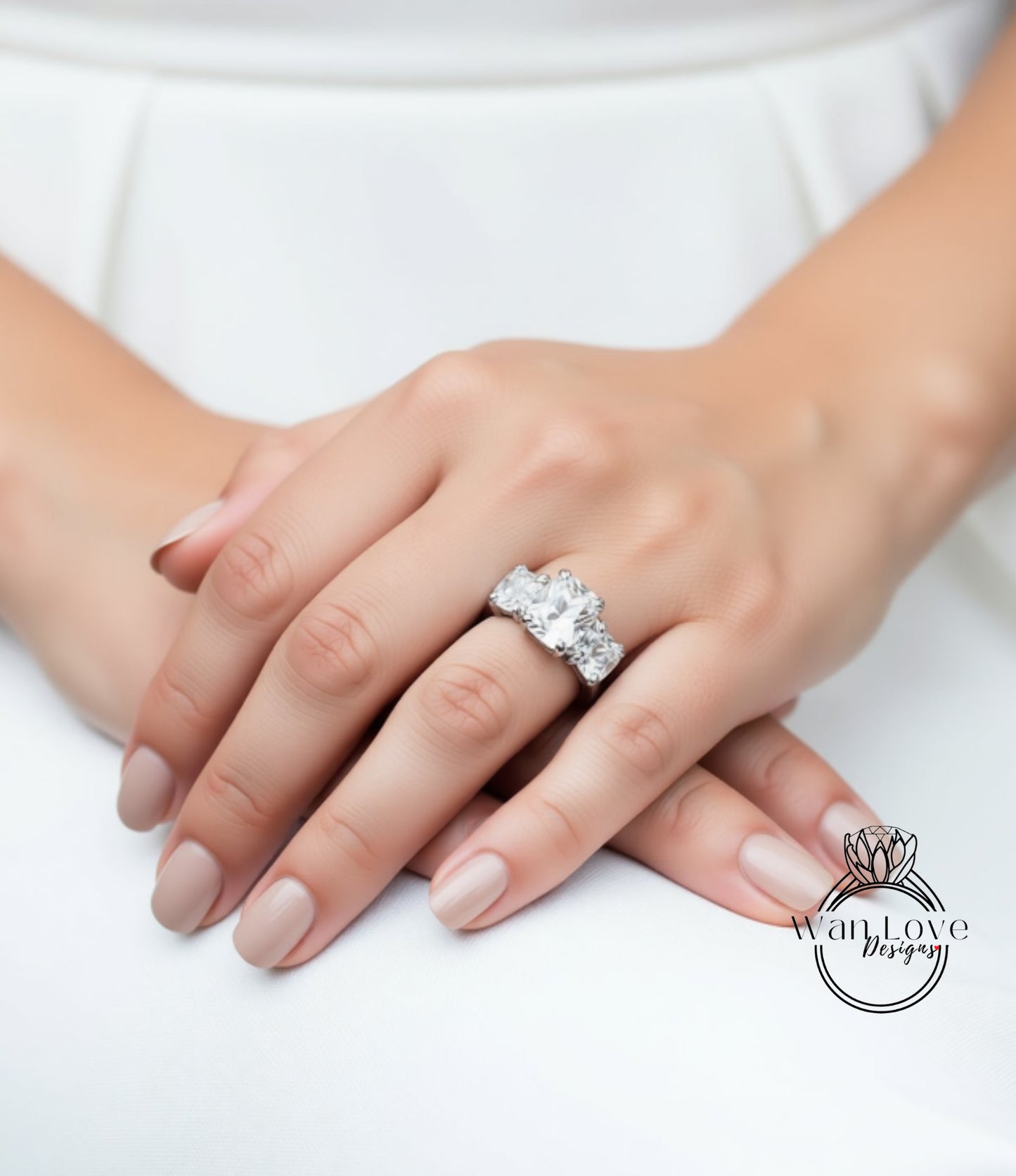 A close-up of a person's hands wearing a large, sparkling diamond engagement ring.