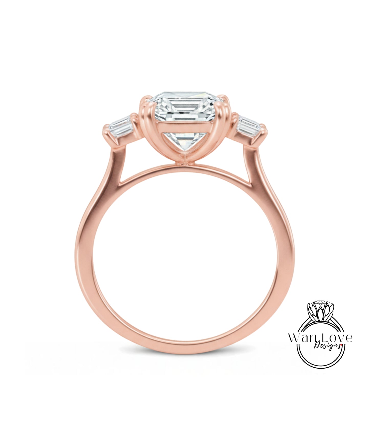 A rose gold engagement ring with a large central diamond and three smaller diamonds on either side.