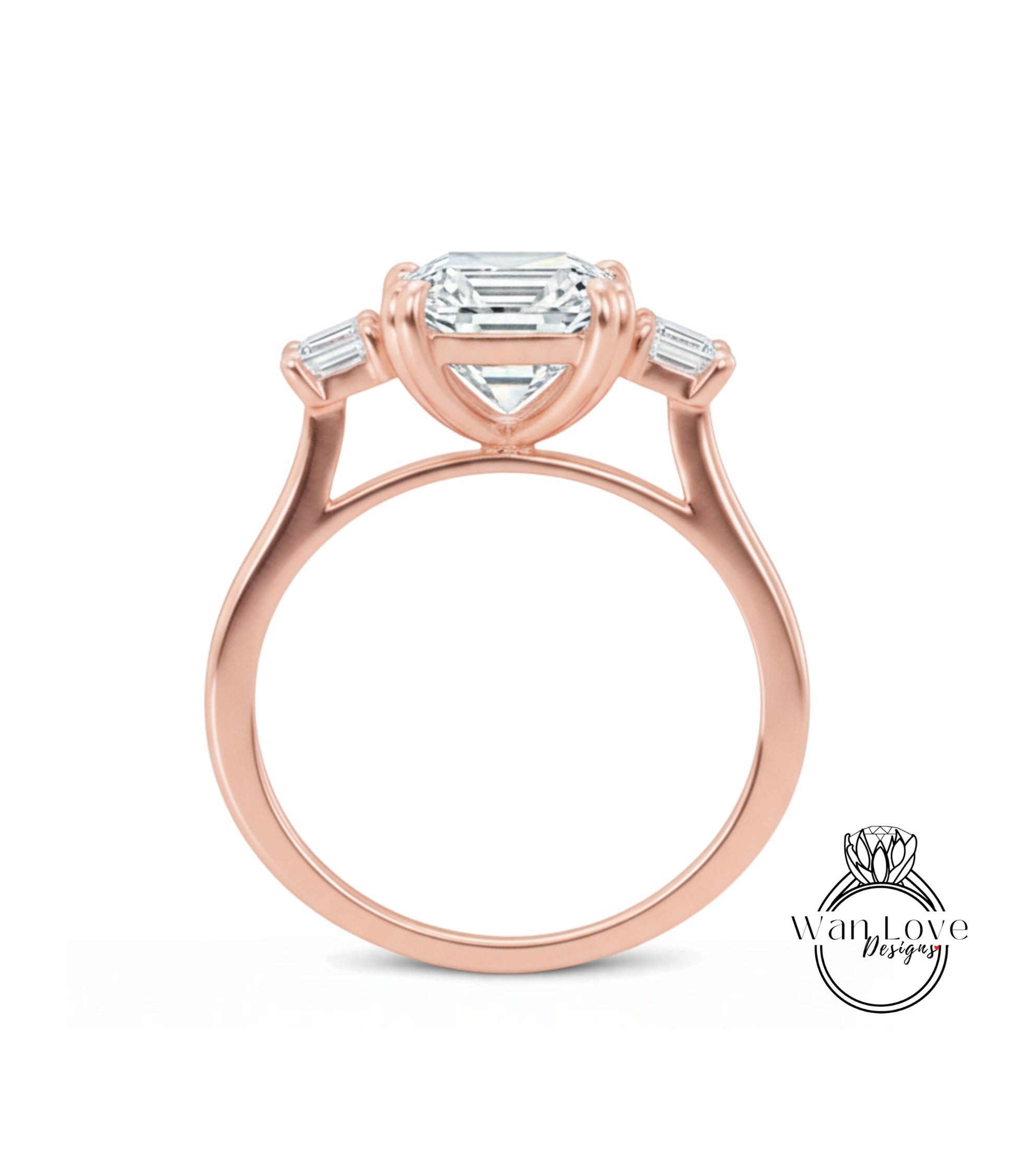 A rose gold engagement ring with a large central diamond and three smaller diamonds on either side.