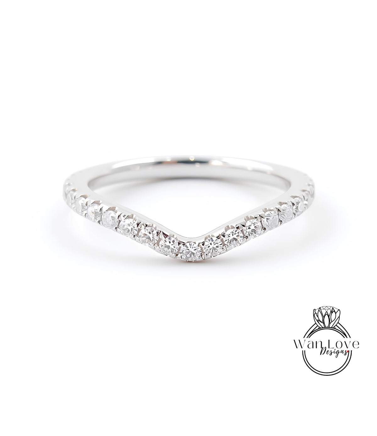 A silver ring with a v-shaped band and small diamonds set in it.