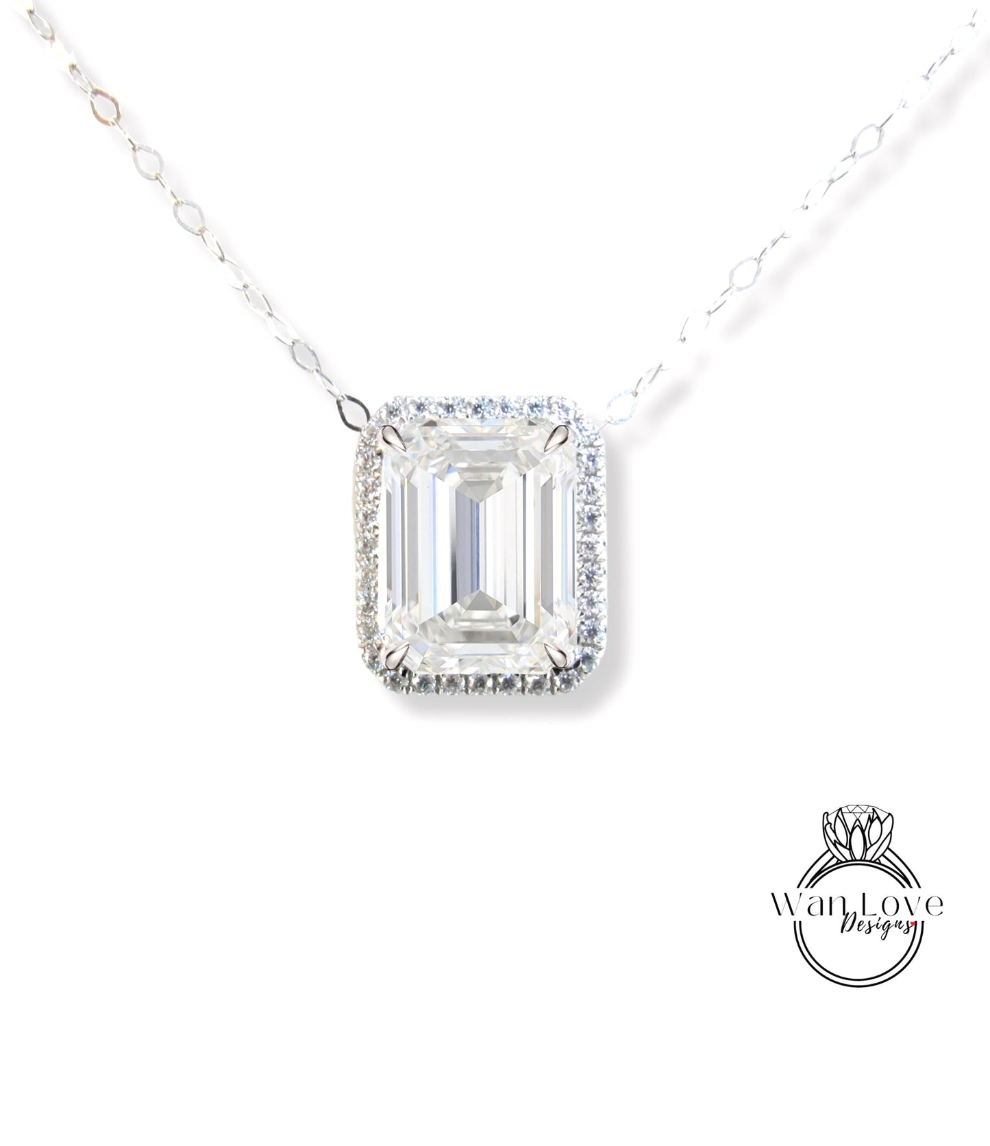 A necklace with a large, clear gemstone pendant, likely a diamond, set in a halo of smaller diamonds.