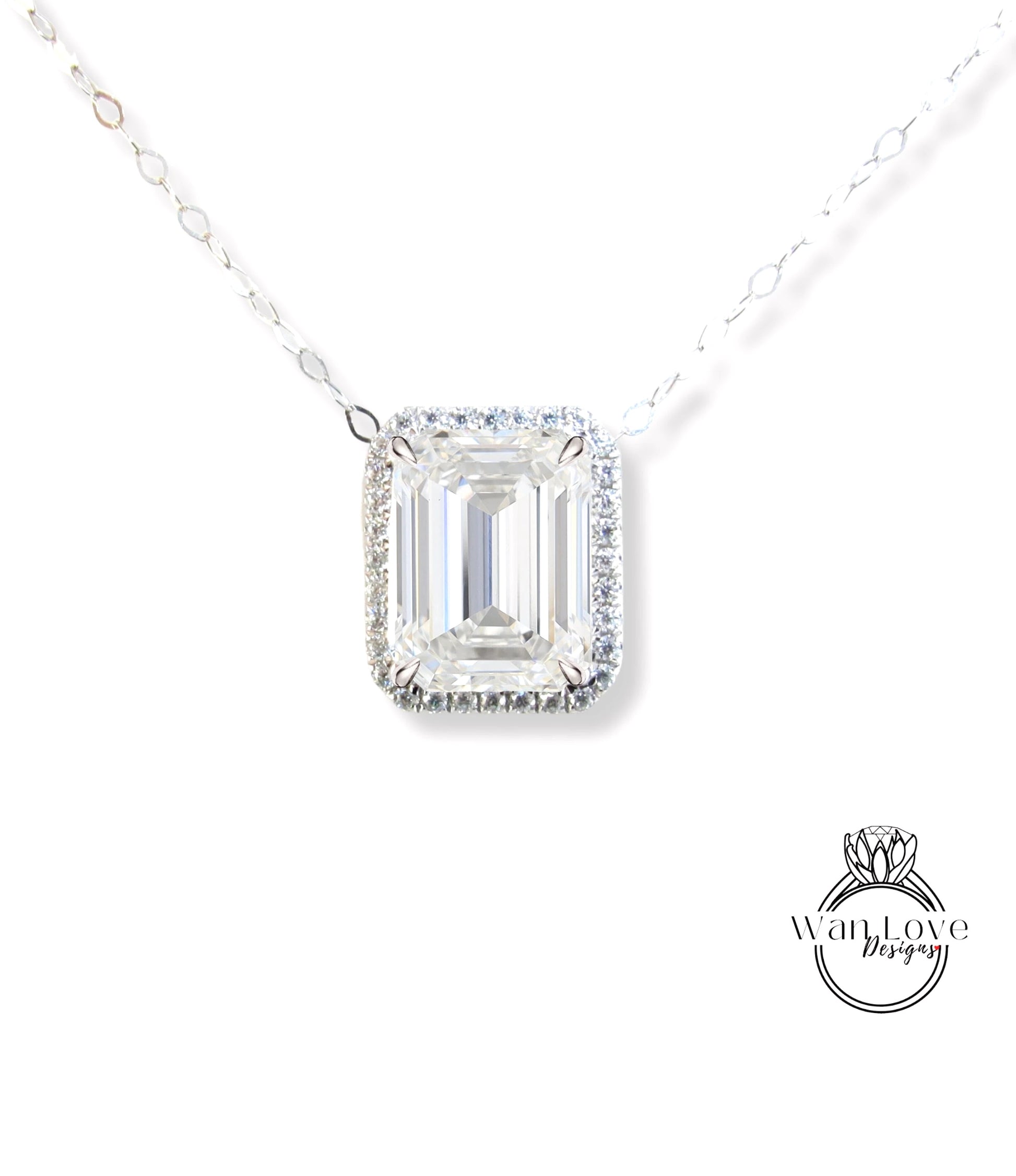 A necklace with a large, clear gemstone pendant, likely a diamond, set in a halo of smaller diamonds.