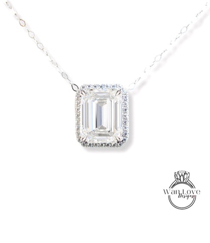 A necklace with a large, clear gemstone pendant, likely a diamond, set in a halo of smaller diamonds.