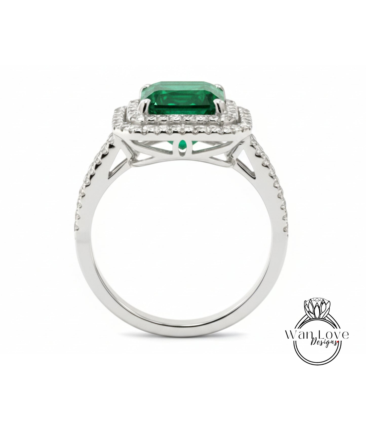 A silver ring with a large, square-cut green gemstone set in a halo of smaller diamonds.