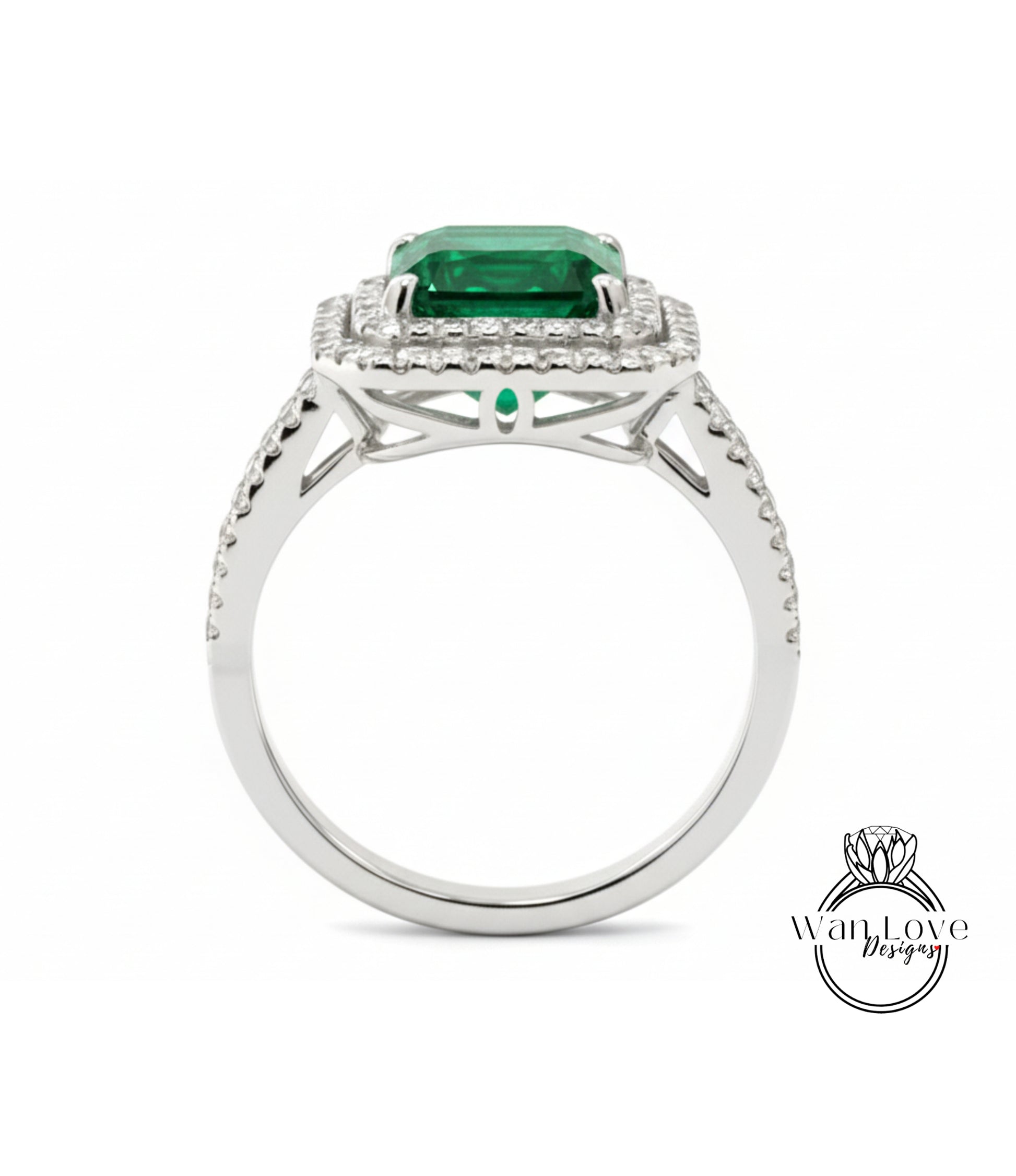 A silver ring with a large, square-cut green gemstone set in a halo of smaller diamonds.