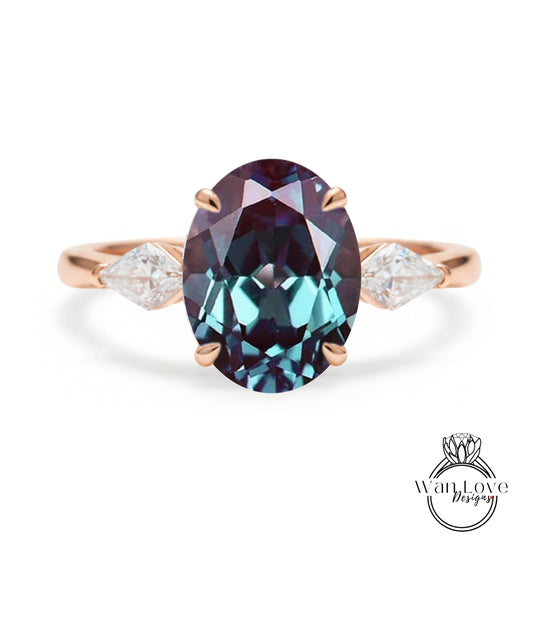A rose gold ring with a large oval-shaped gemstone in the center, surrounded by smaller diamonds on either side.