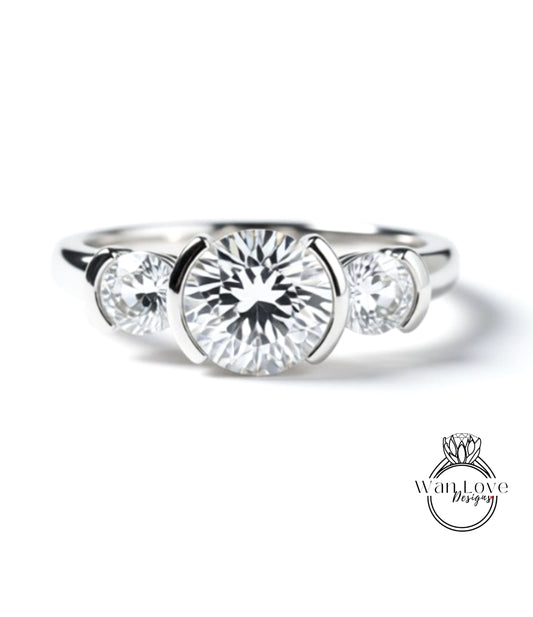 A close-up view of a silver ring with a large, round diamond in the center, surrounded by smaller diamonds.