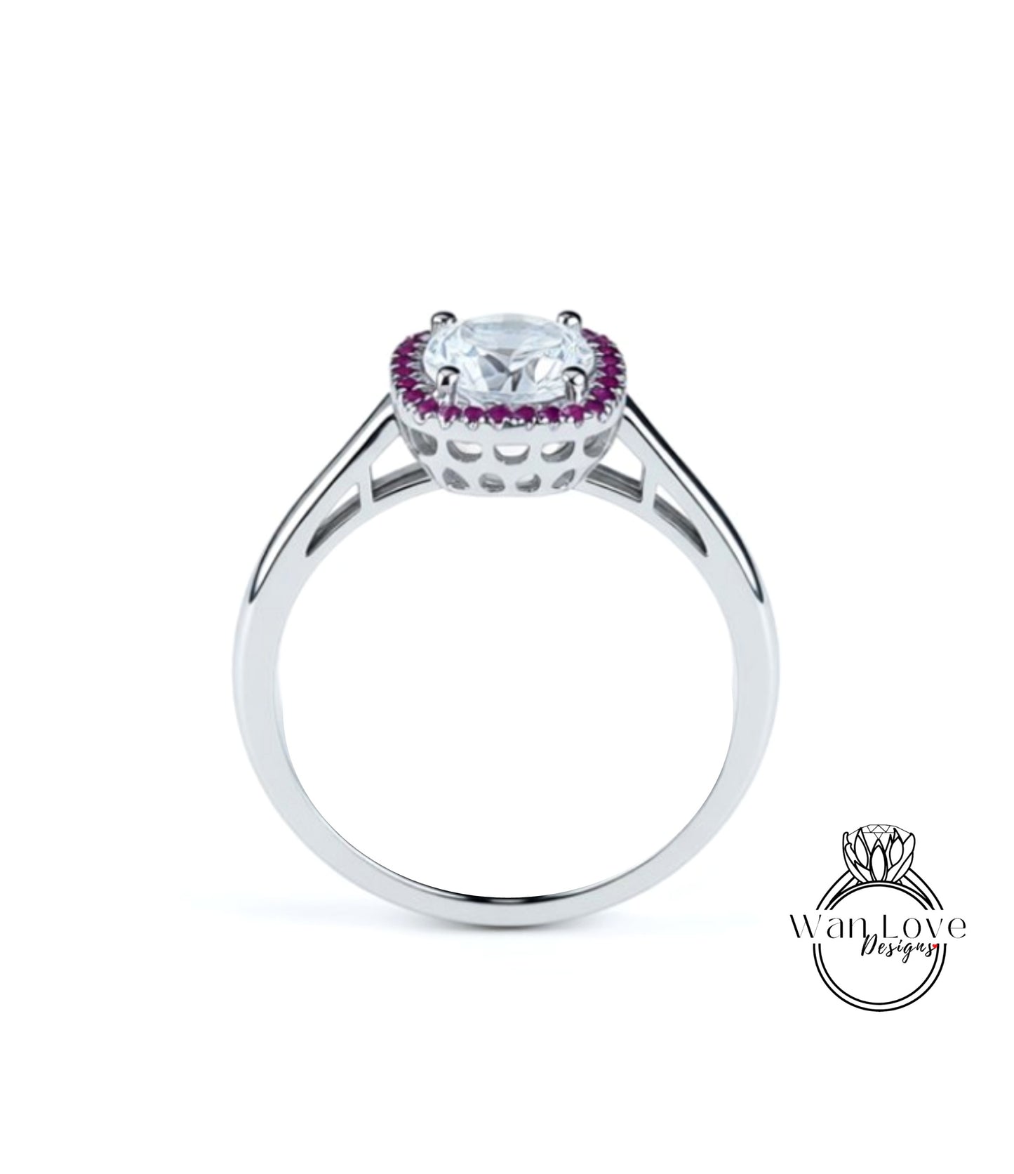 A silver ring with a large central gemstone surrounded by smaller purple stones.