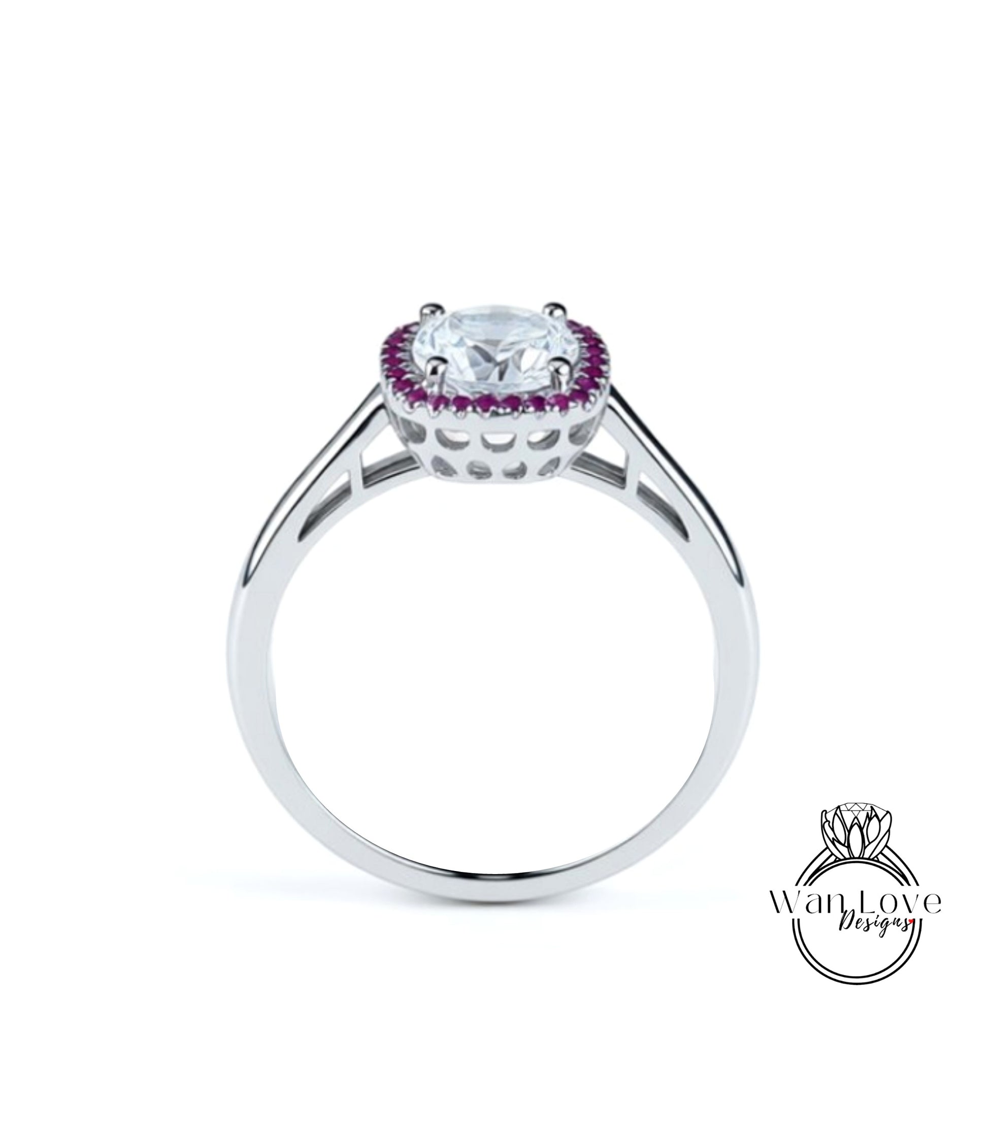 A silver ring with a large central gemstone surrounded by smaller purple stones.