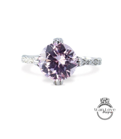 A close-up image of a beautiful purple gemstone ring with a large central gemstone surrounded by smaller stones.