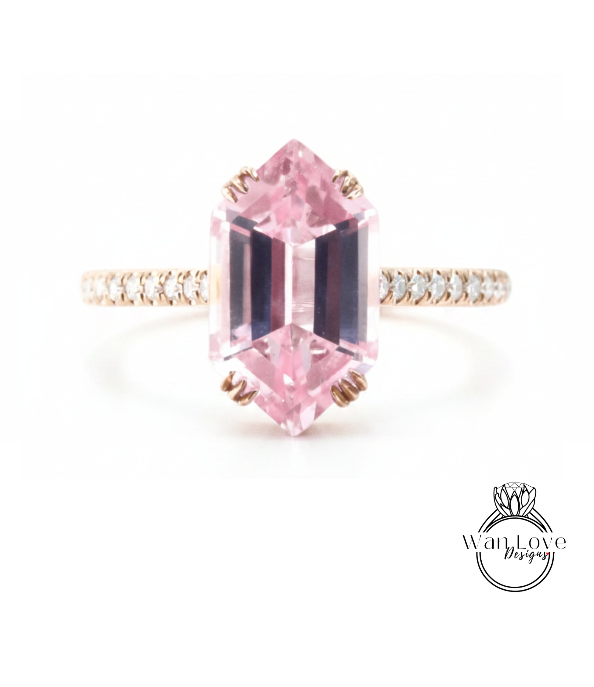 A pink gemstone engagement ring with a gold band and small diamonds around the band.