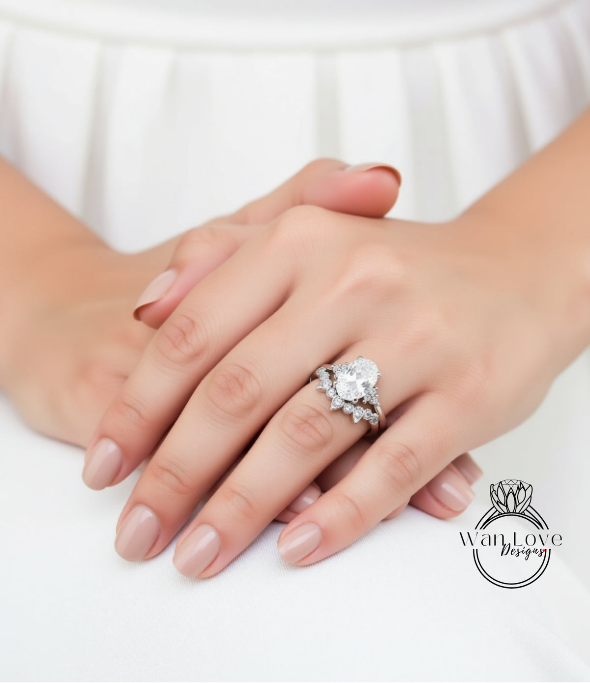 A close-up of a person's hands wearing a large diamond engagement ring.