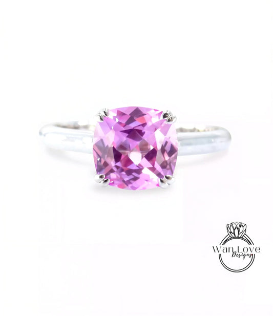 A ring with a large, pink gemstone set in a silver band.