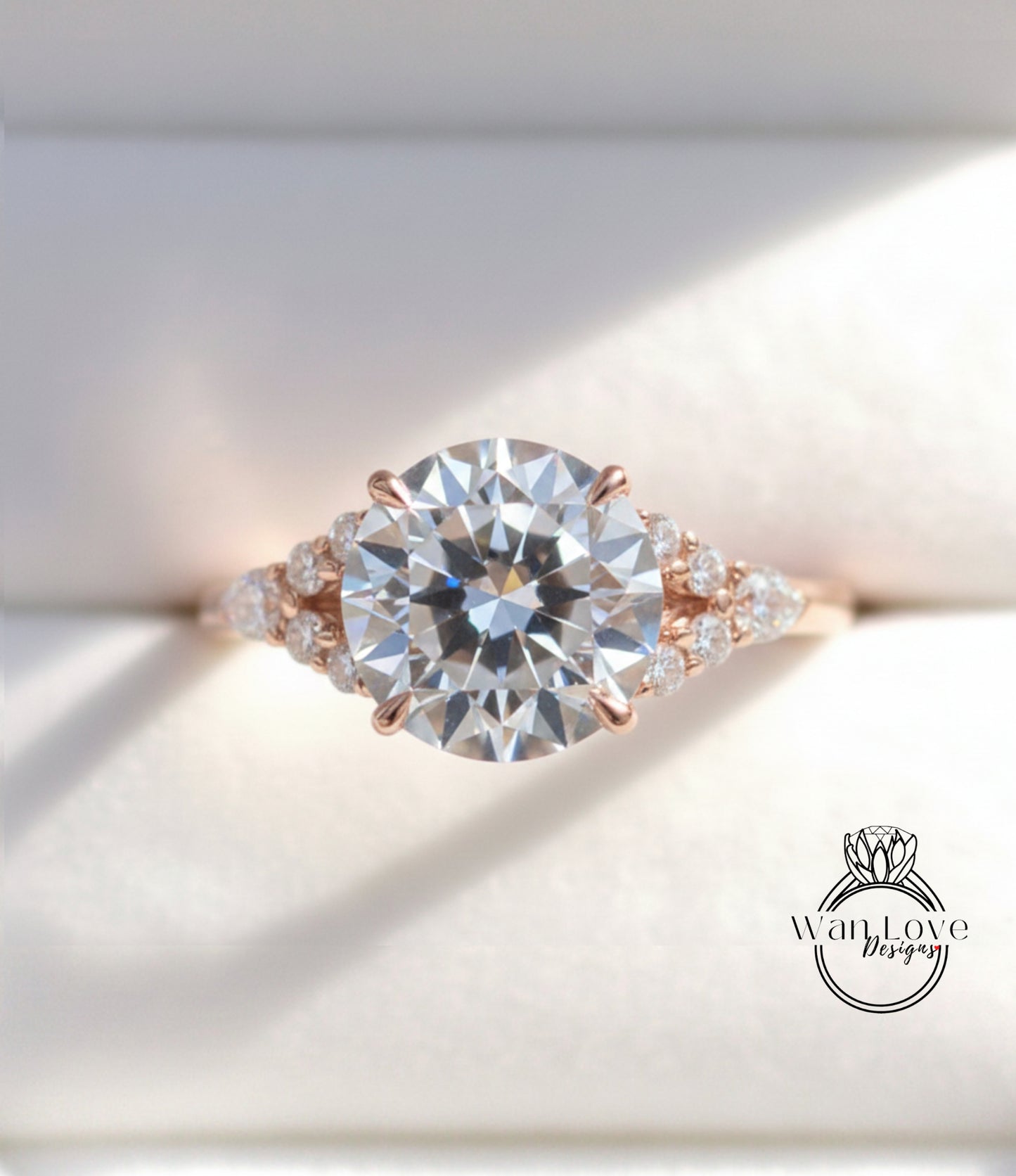A close-up view of a beautiful engagement ring with a large round diamond set in a rose gold band, surrounded by smaller diamonds.