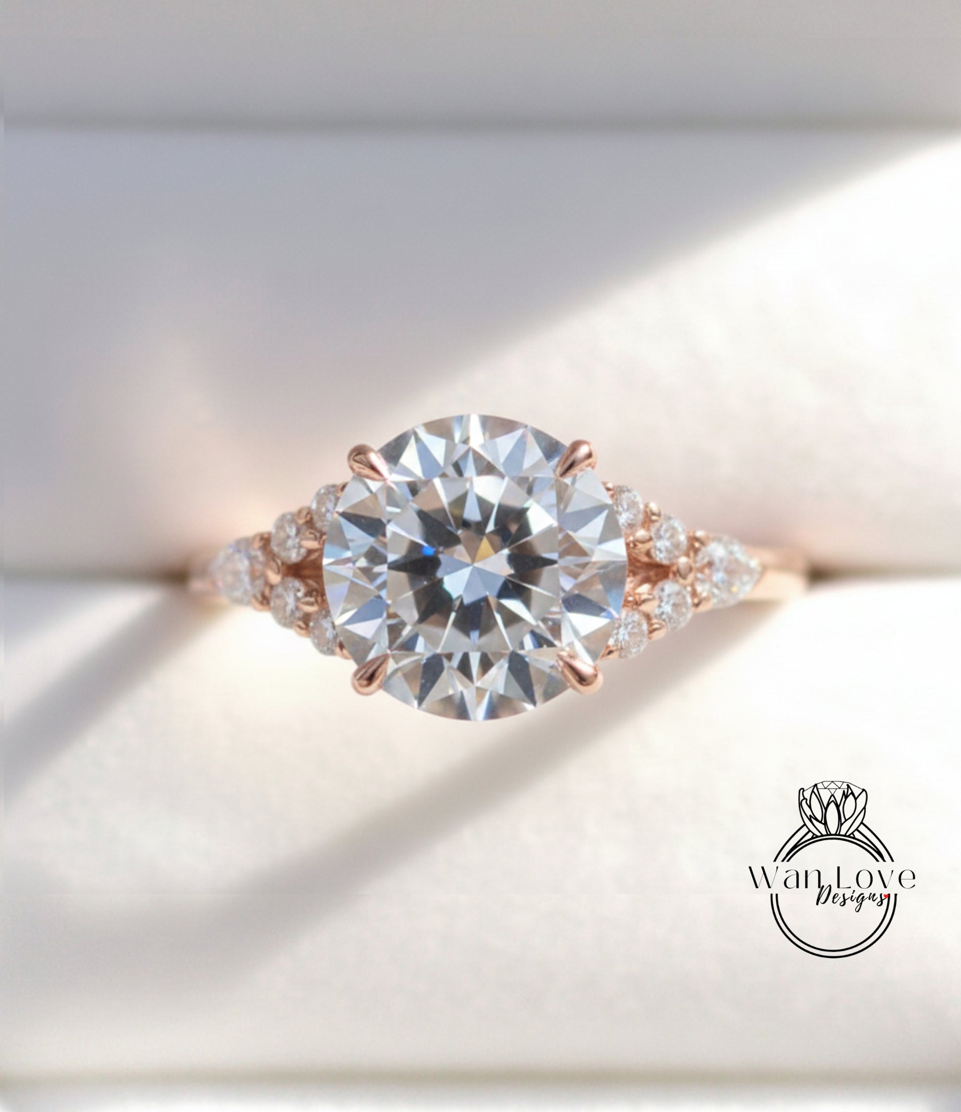 A close-up view of a beautiful engagement ring with a large round diamond set in a rose gold band, surrounded by smaller diamonds.