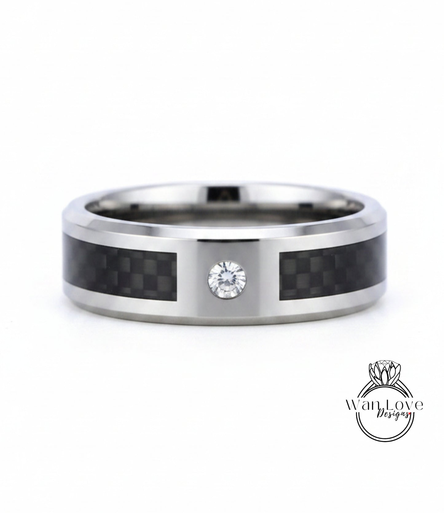 A silver ring with a carbon fiber band and a diamond set in the center.