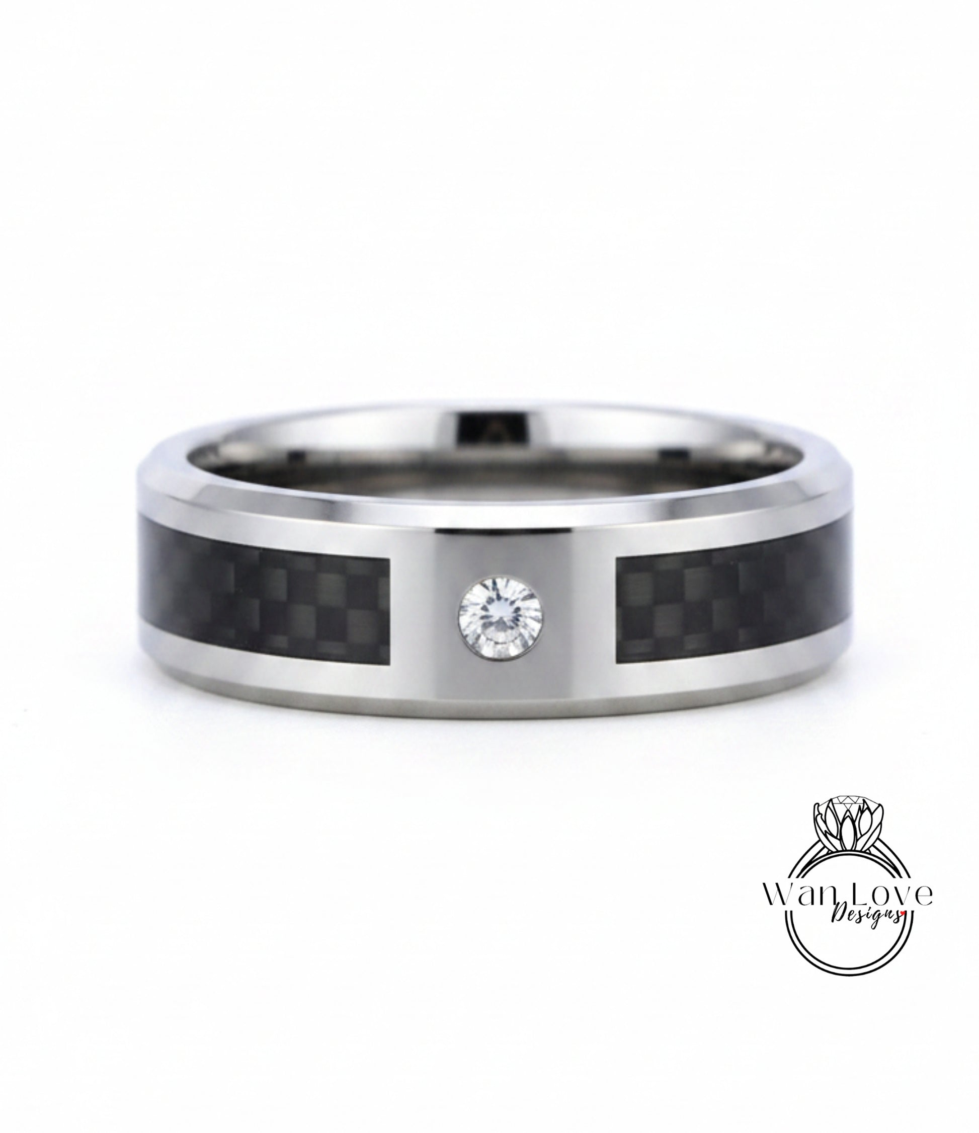 A silver ring with a carbon fiber band and a diamond set in the center.