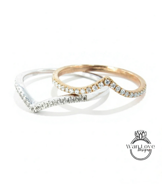 Two rings with diamond-encrusted bands are displayed against a white background.