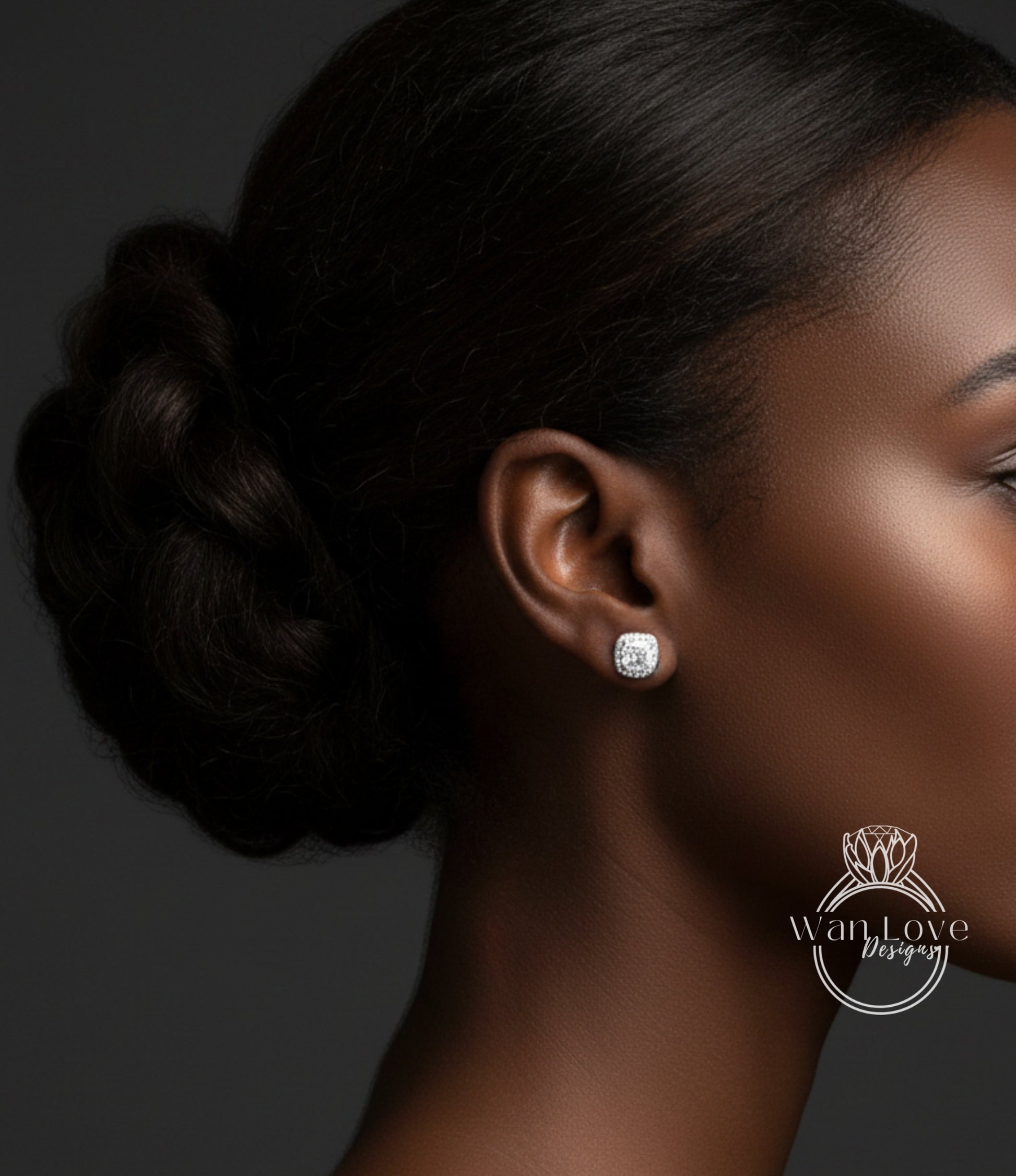 A close-up of a woman's face, focusing on her earrings and hair.