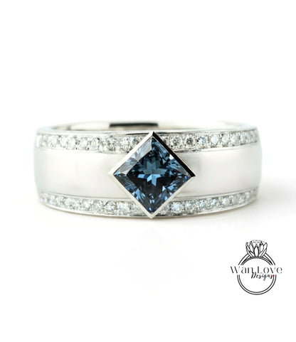 A silver ring with a large blue gemstone in the center, surrounded by smaller diamonds.