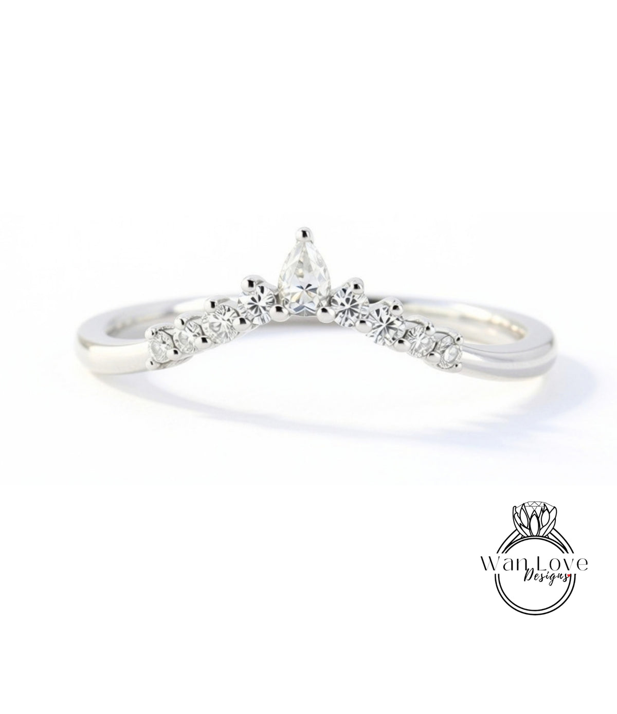 A silver ring with a large diamond in the center, surrounded by smaller diamonds, and a small diamond at the top.