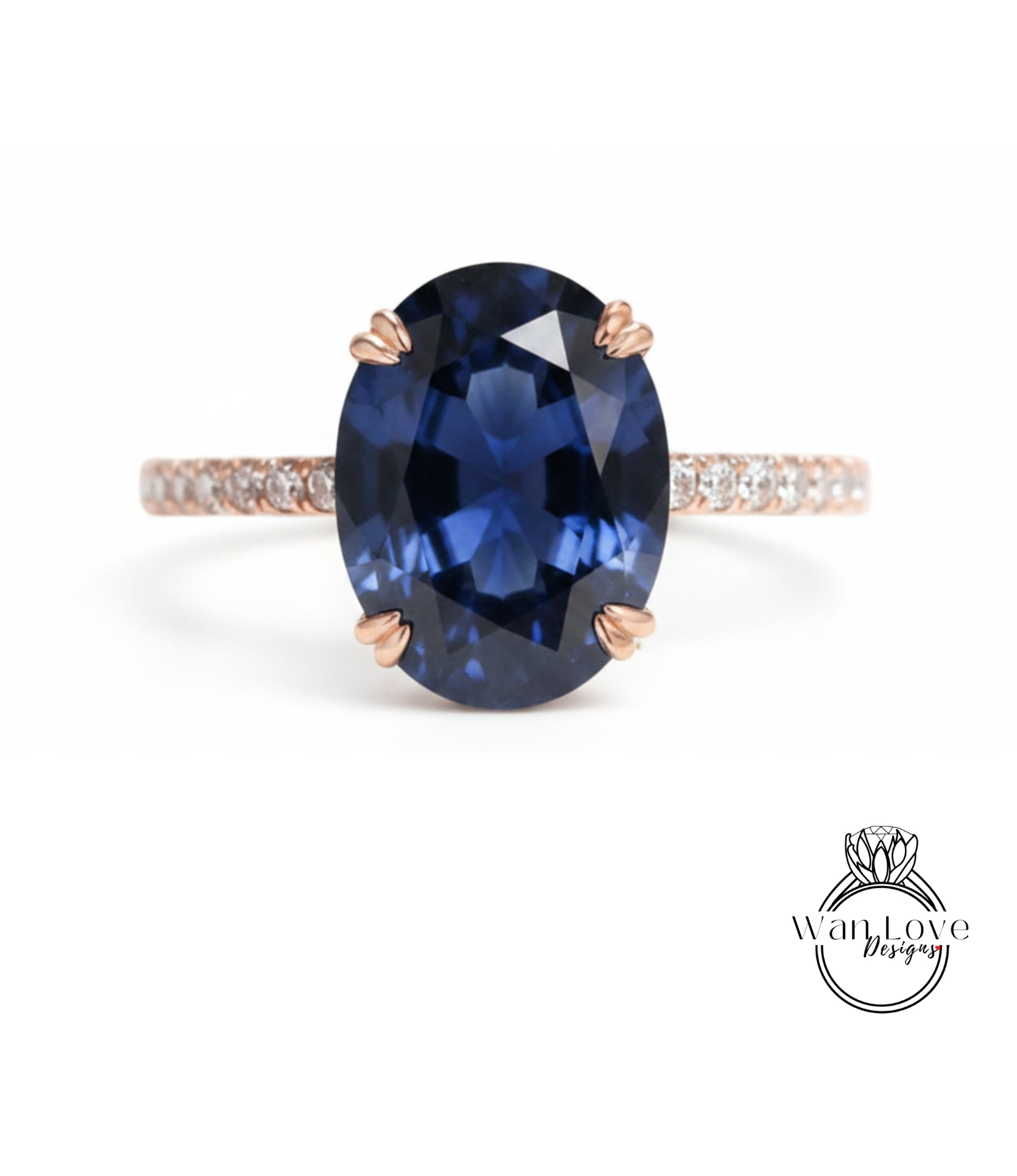 A close-up image of a blue gemstone ring with a large oval-shaped blue gemstone set in a rose gold band.
