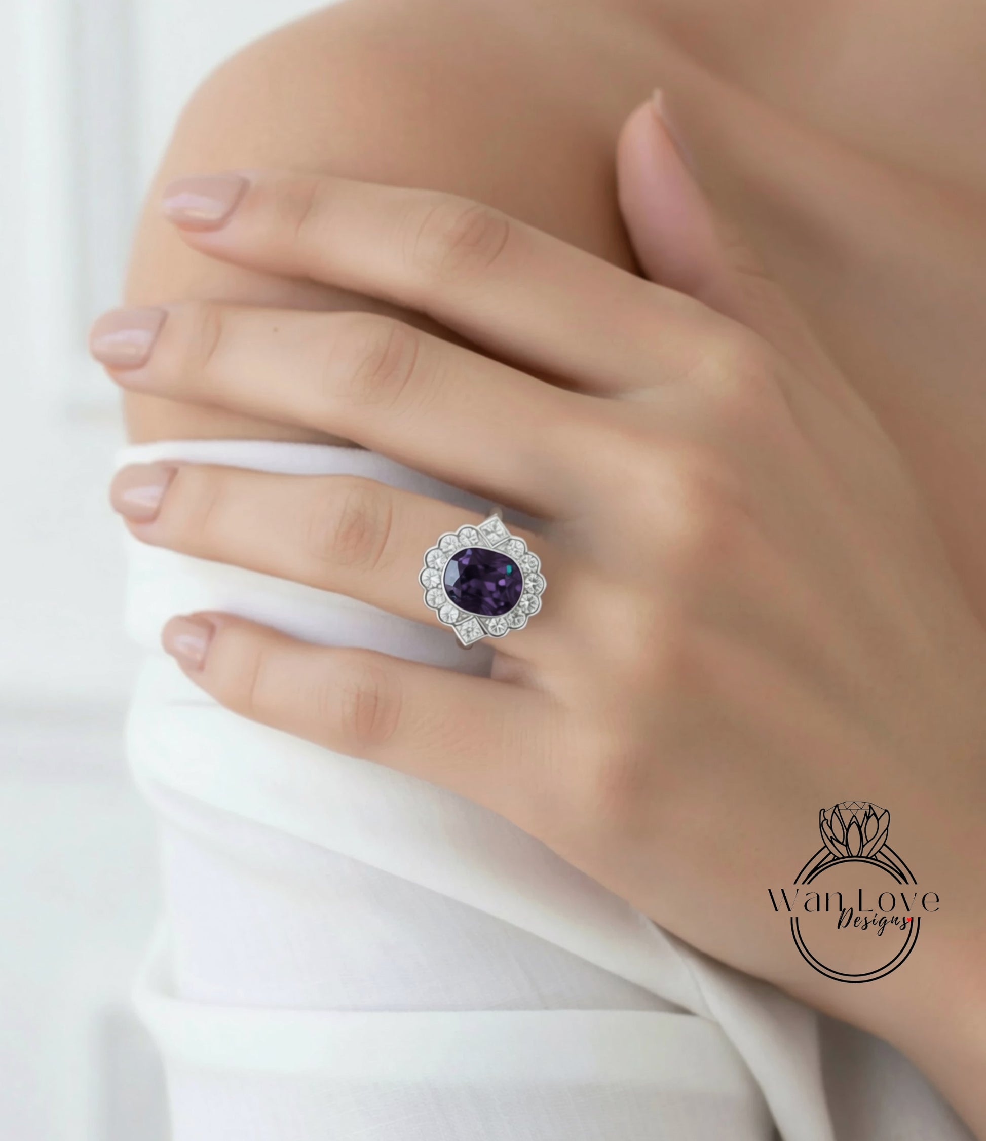 A close-up of a person's hand wearing a large, ornate ring with a purple gemstone.