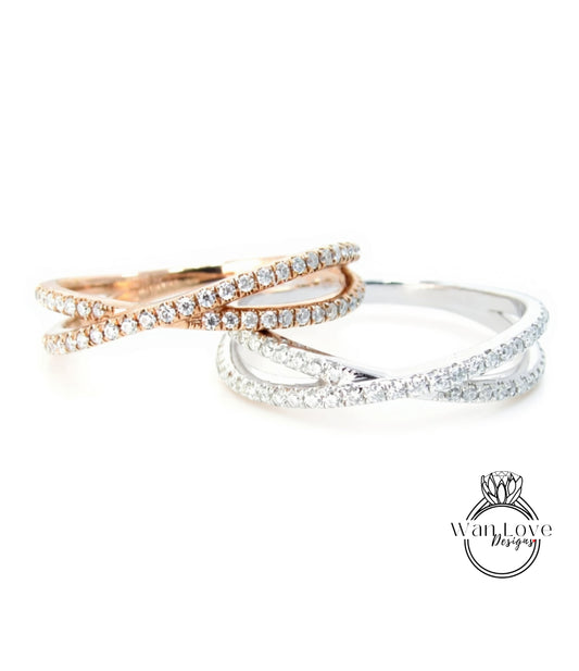 two rings with a combination of silver and gold designs, featuring a large number of small diamonds.