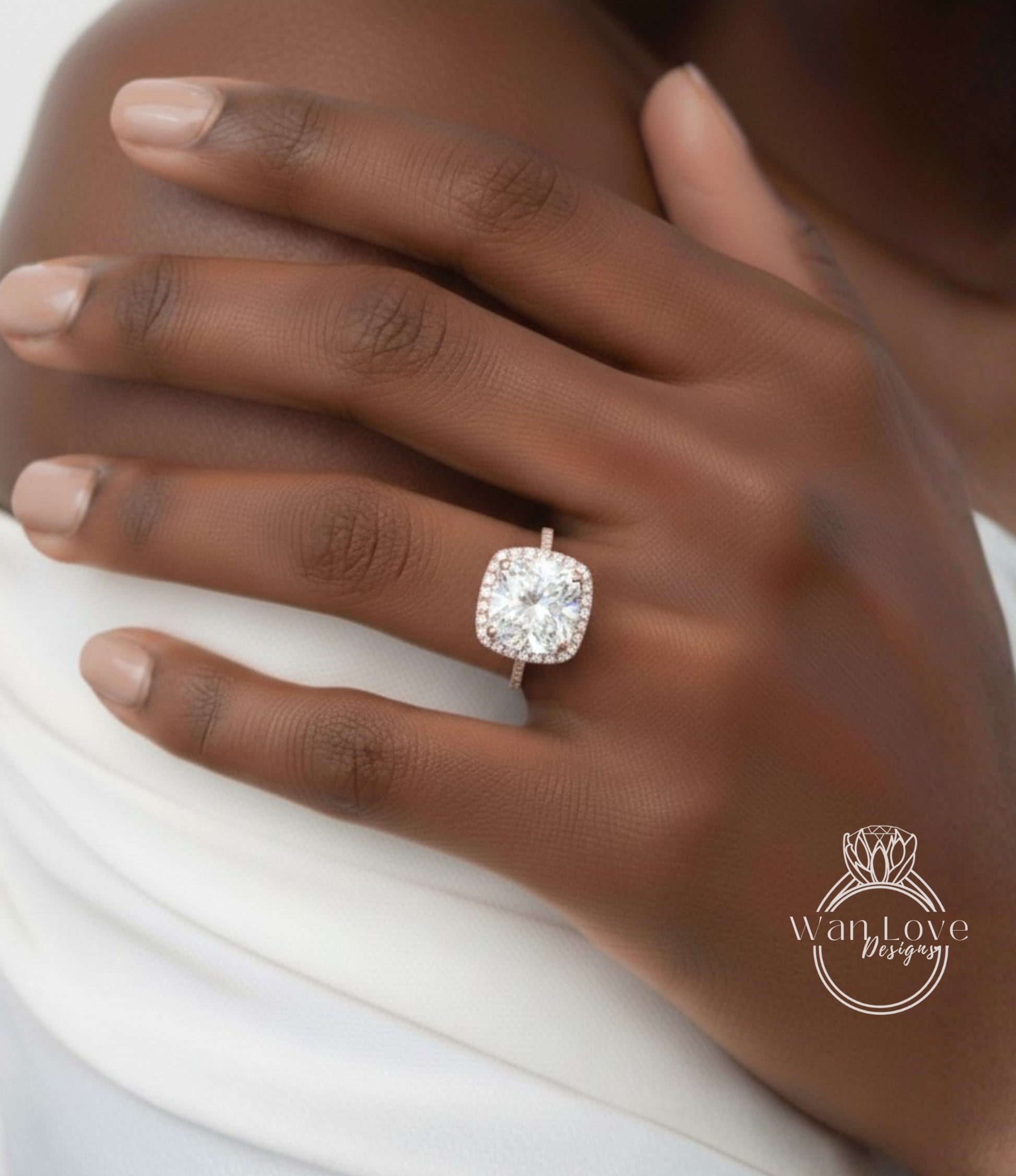 A close-up of a person's hand wearing a large, sparkling diamond engagement ring.
