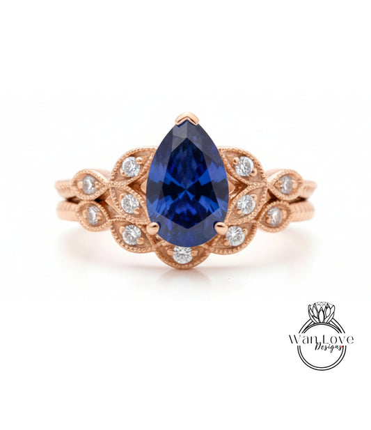 a beautiful engagement ring with a large blue gemstone set in a rose gold band.