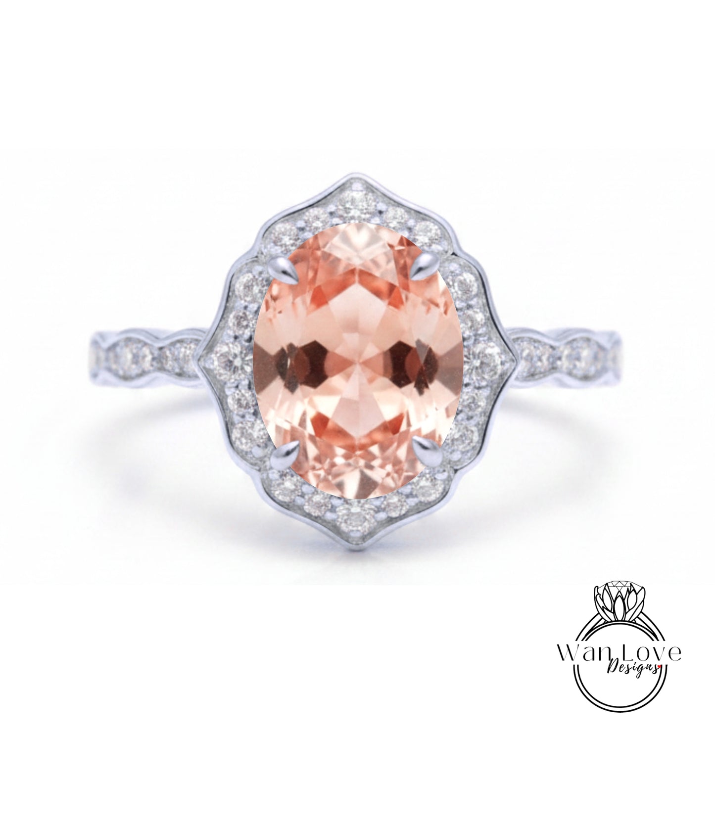 A beautiful engagement ring with a large oval-shaped gemstone surrounded by a halo of smaller diamonds set in a silver band.