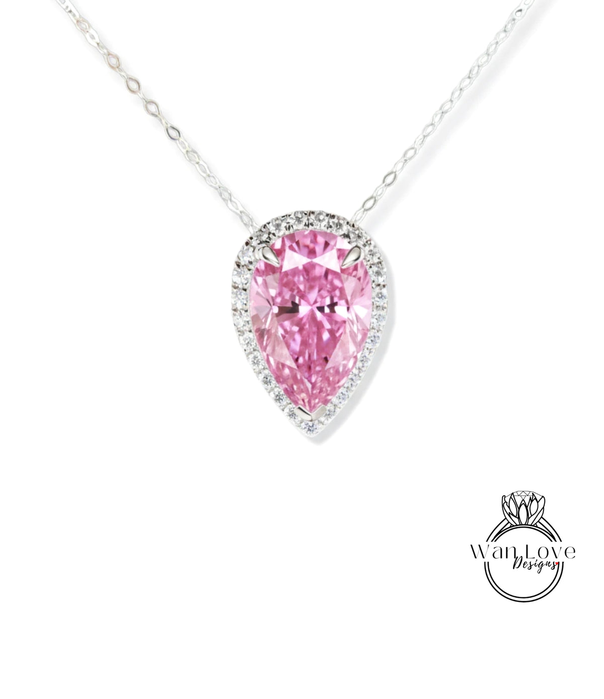 A necklace with a large, pink pear-shaped diamond set in a halo of smaller diamonds.