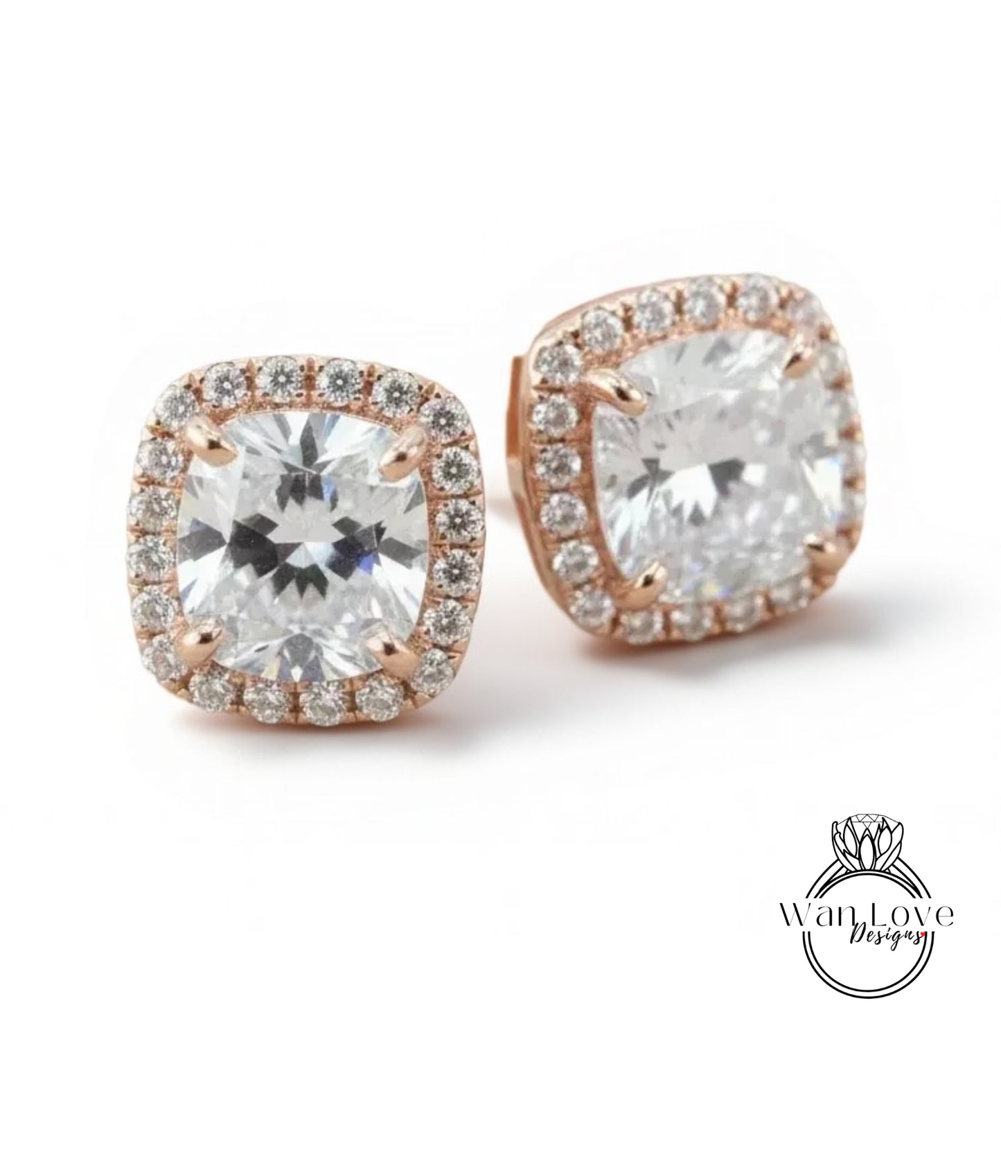 A pair of elegant earrings with large, clear gemstones set in a rose gold frame.