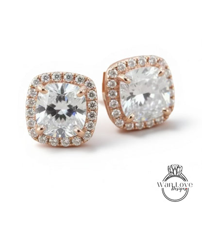 A pair of elegant earrings with large, clear gemstones set in a rose gold frame.